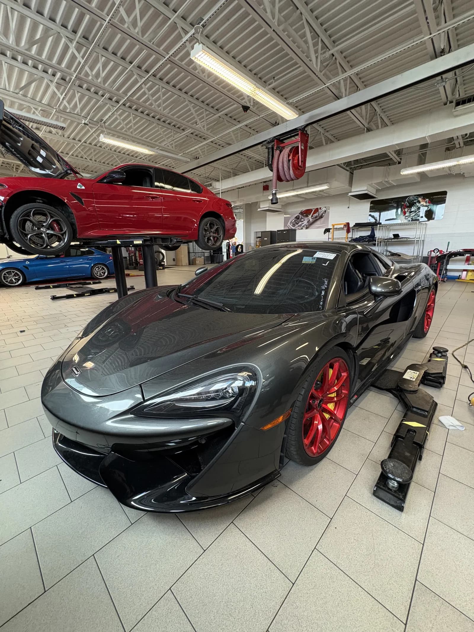 Black Porsche 911 at dealership