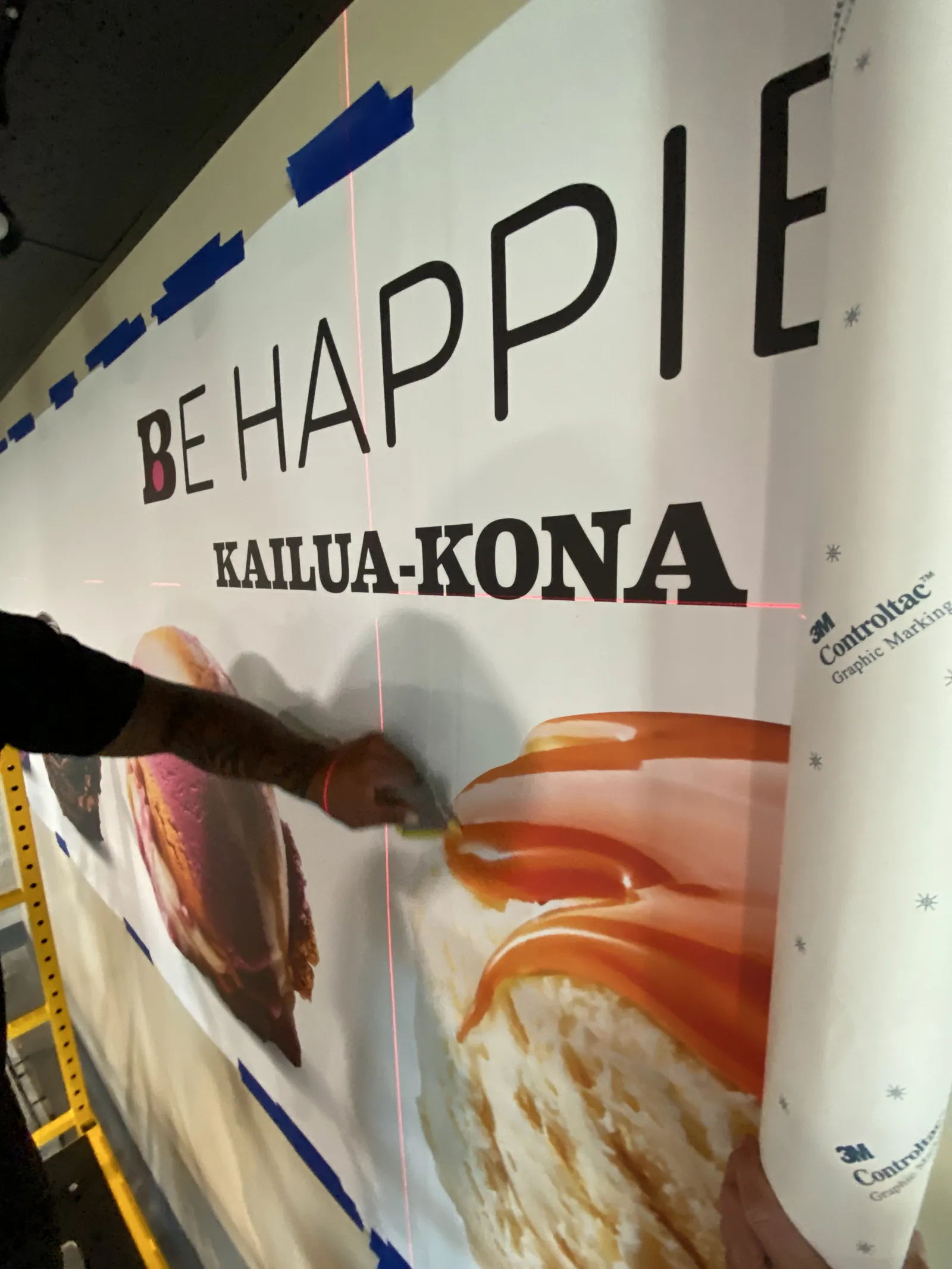 3M graphic film installation on commercial storefront