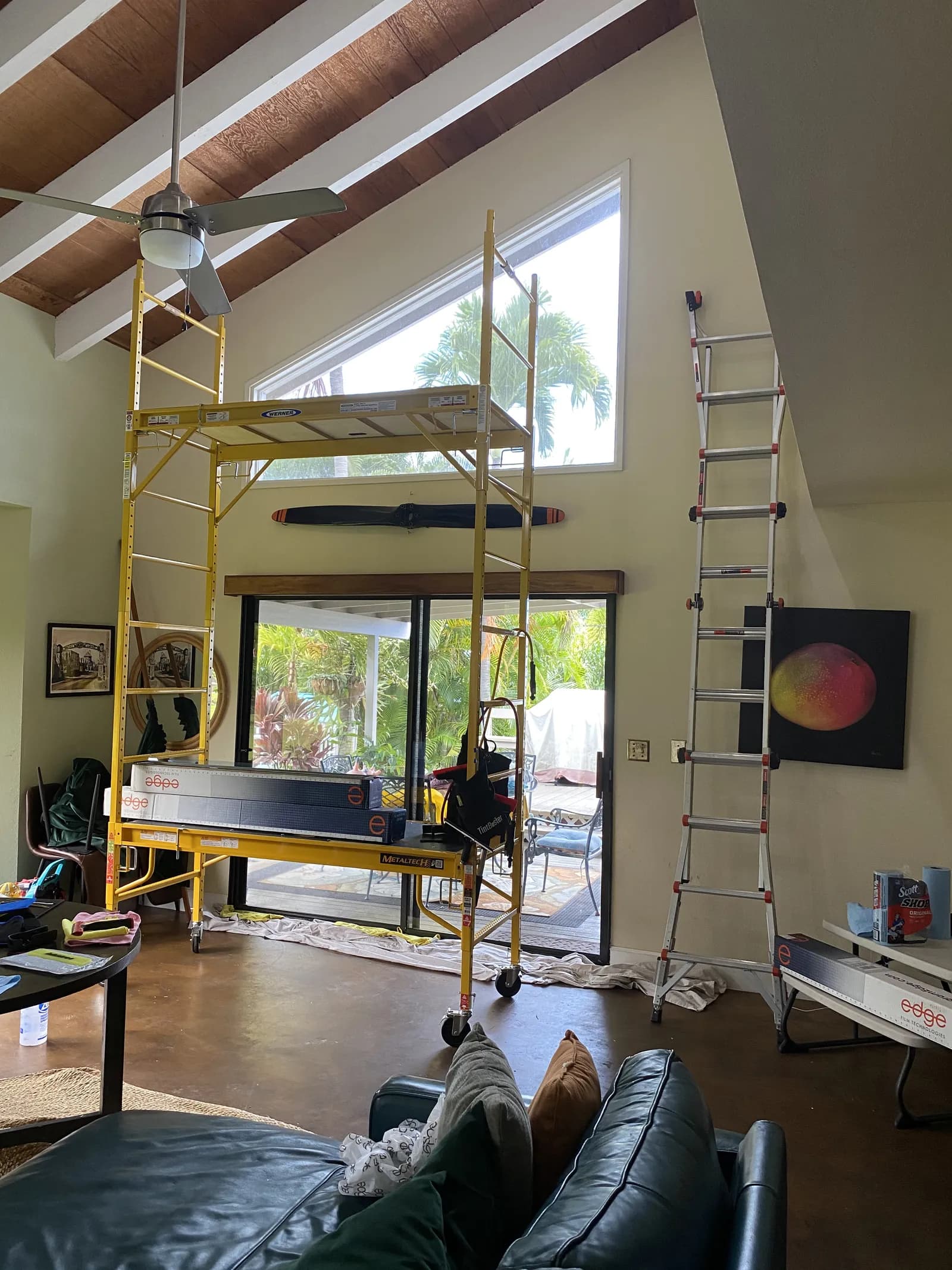 Vaulted ceiling residential window tint with scaffolding