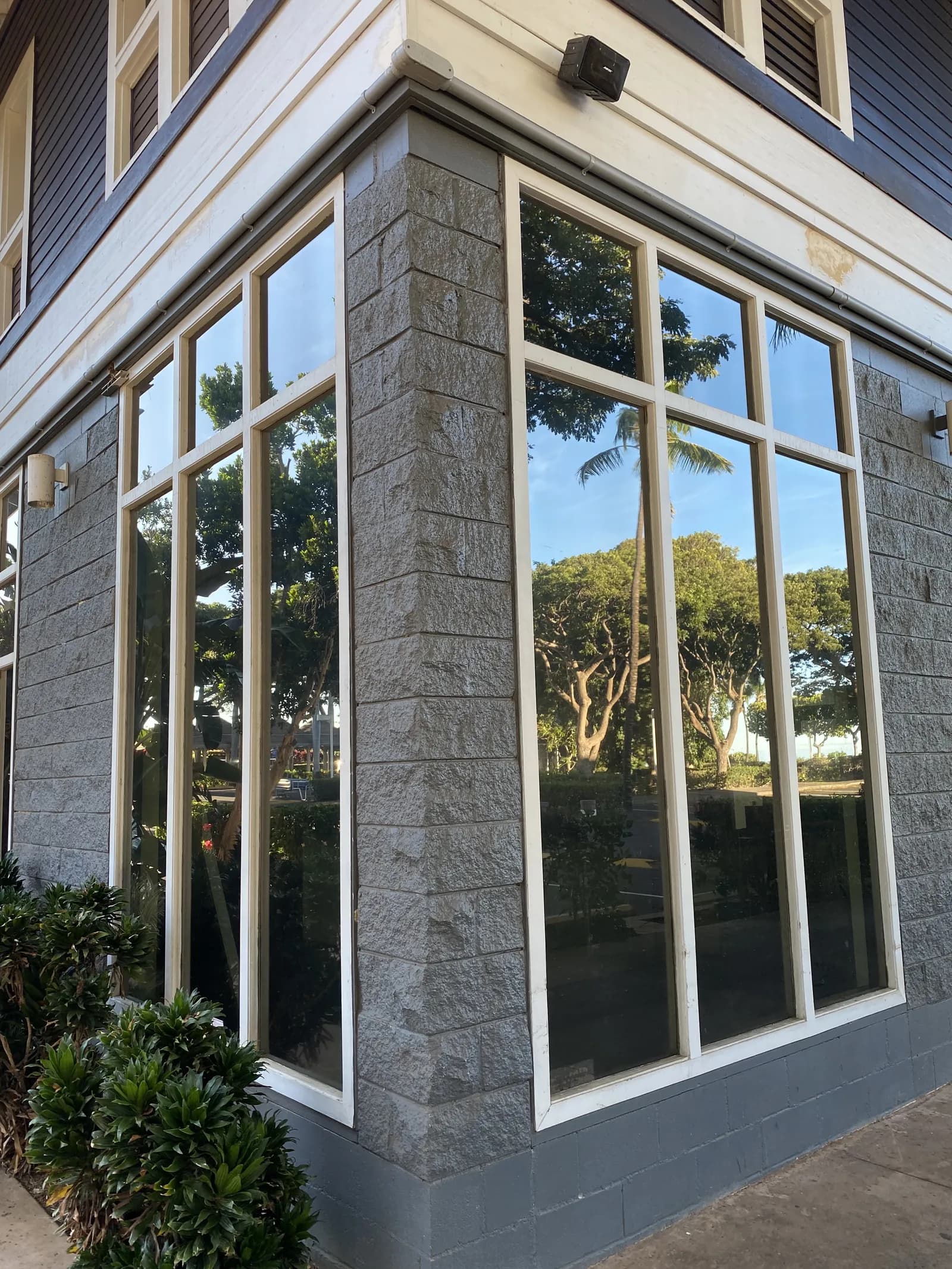 Corner storefront with reflective tint film