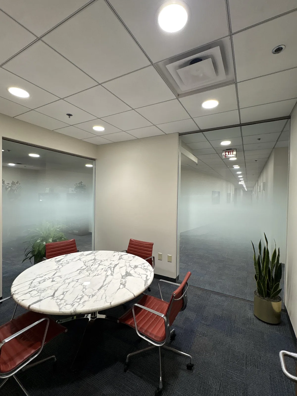 Conference room with frosted decorative privacy film providing confidentiality