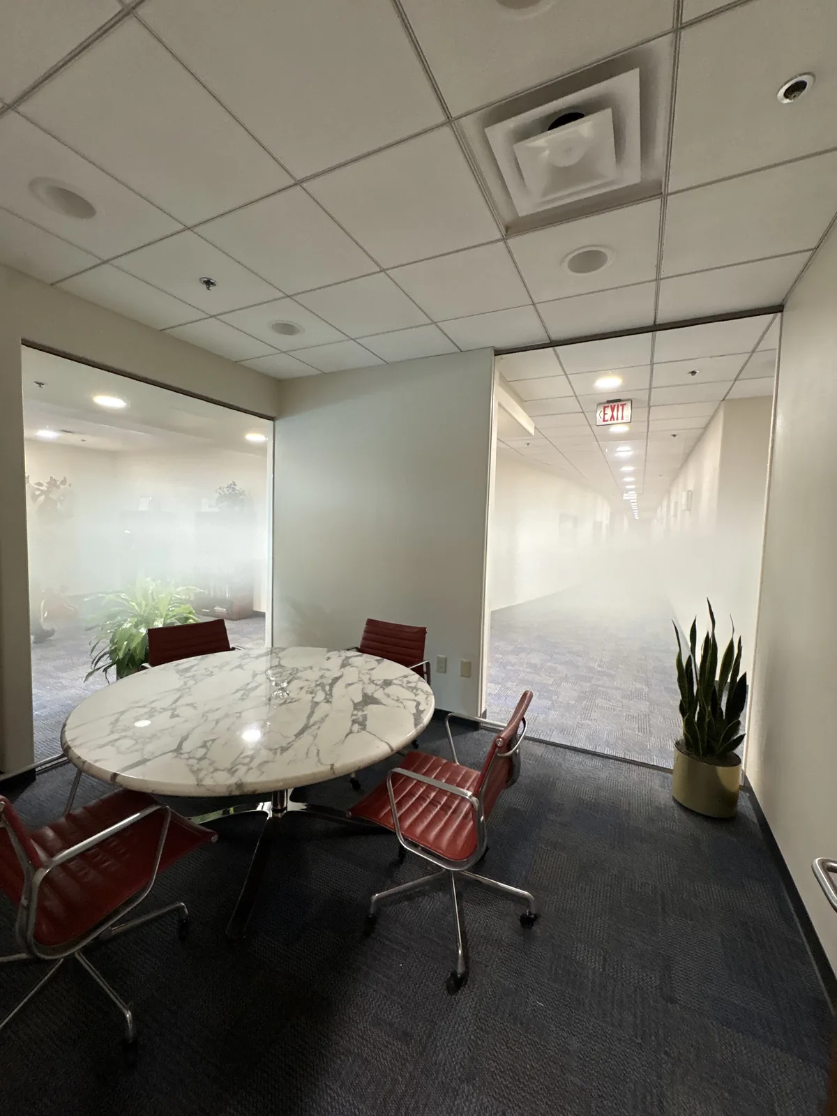 Alternate view of conference room showing dual gradient film balancing privacy and openness